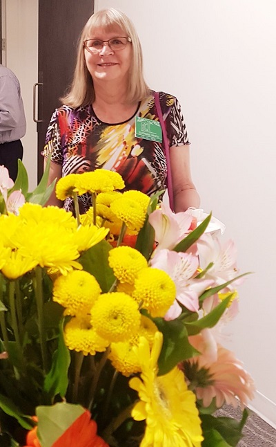 Sue and flowers
